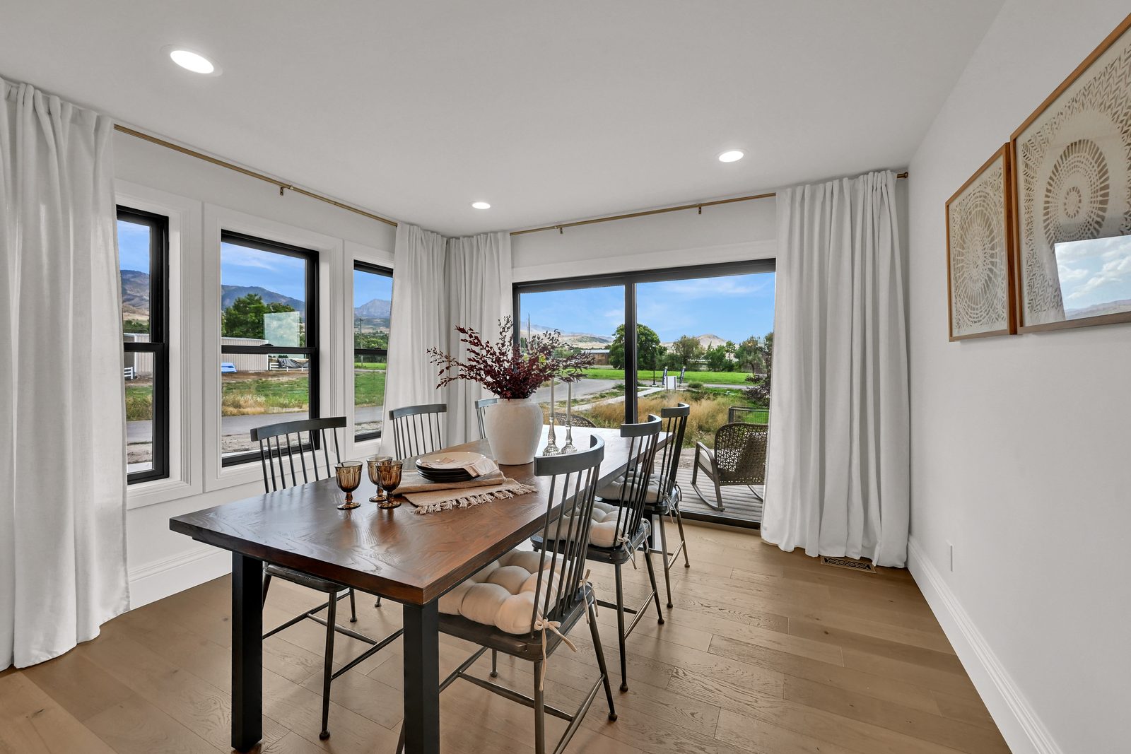 The Lucy dining area with black-framed windows, 2025 Top of Utah Parade of Homes