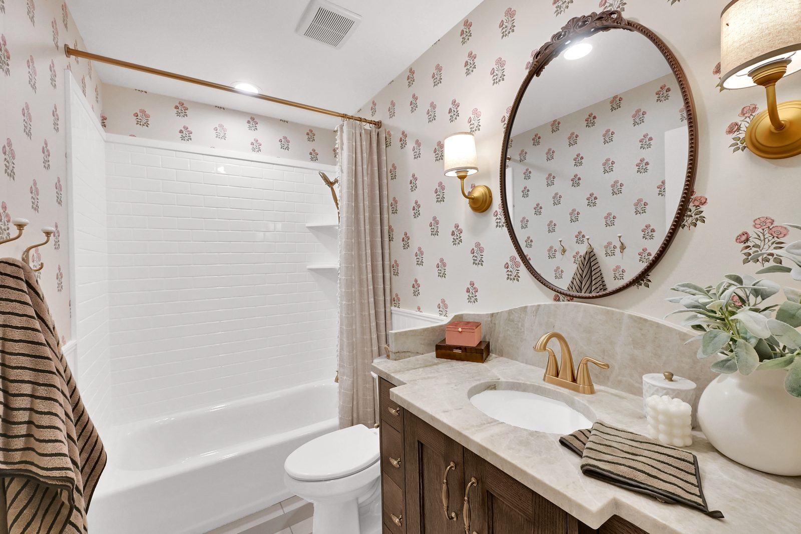 The Lucy bathroom with wood vanity and floral wallpaper, 2025 Top of Utah Parade of Homes