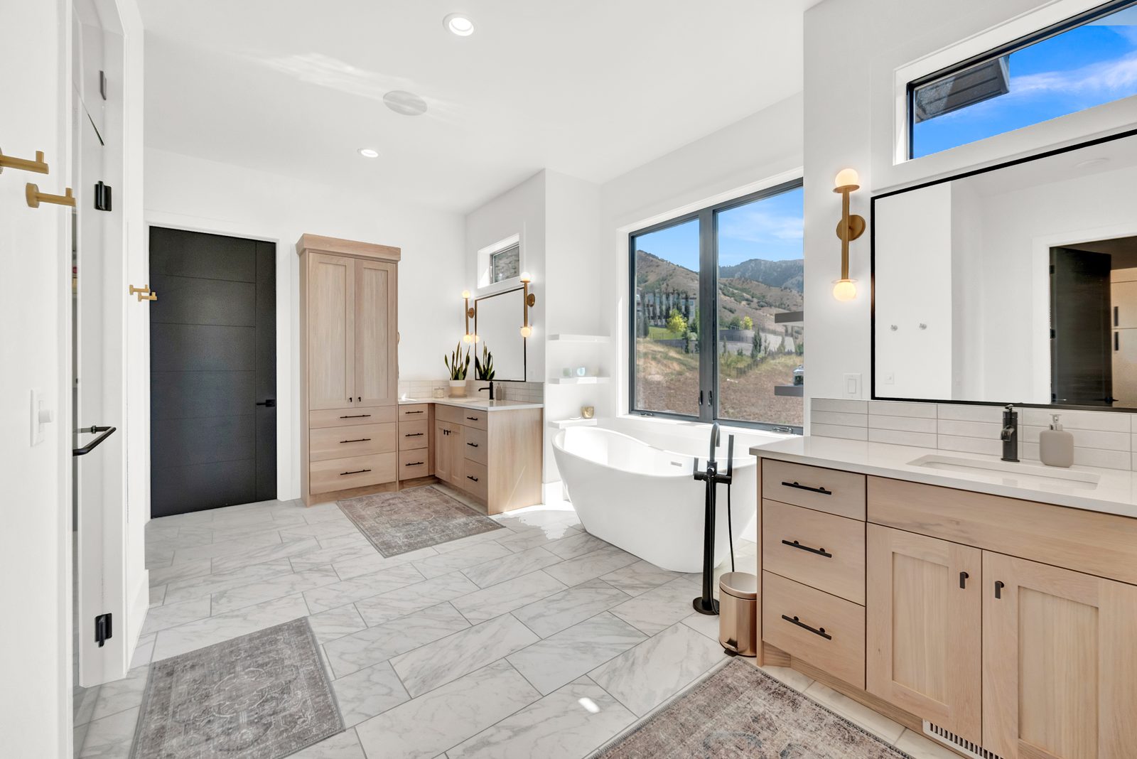Valley View Estate primary bathroom with freestanding soaking tub and double vanity, 2023 Top of Utah Parade of Homes