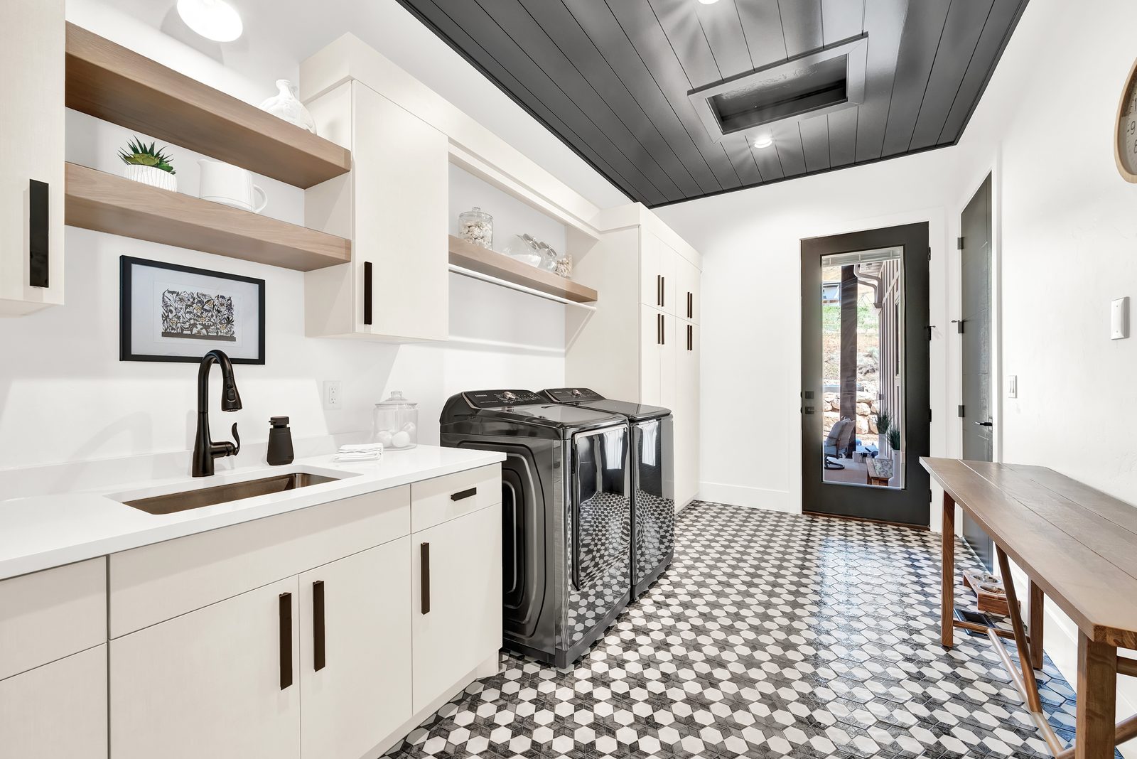 Valley View Estate laundry and mudroom with patterned tile floor, 2023 Top of Utah Parade of Homes